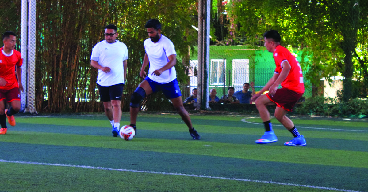 Surendra Kumar Yadav, Joint Secretary of Foreign Ministry of Nepal, and a player of MoFA Nepal team, vying the ball aganist Embassy of India in Kathmandu team during the first Diplomatic Futsal Tournament in Kathmandu.