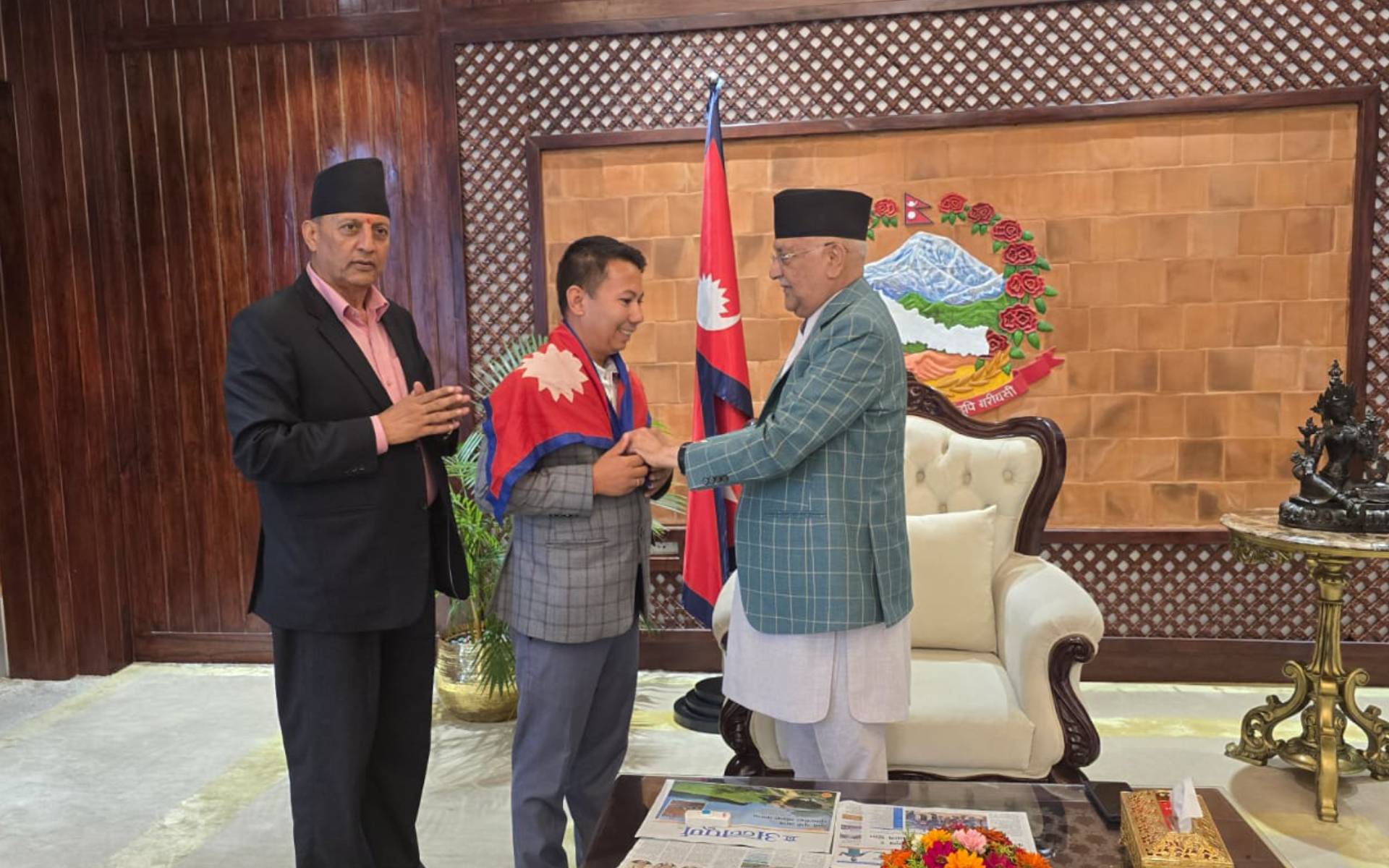PM Oli Bids Farewell to Mountaineer Pandey for Carstensz Pyramid Climb