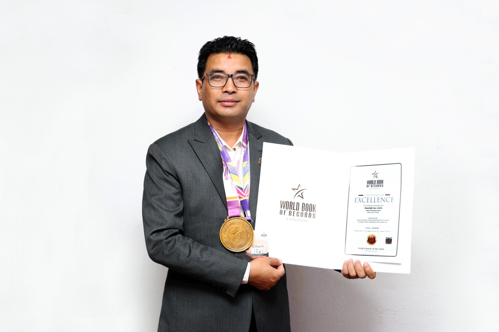 Photojournalist Onta Honored by ‘World Book of Records, London’