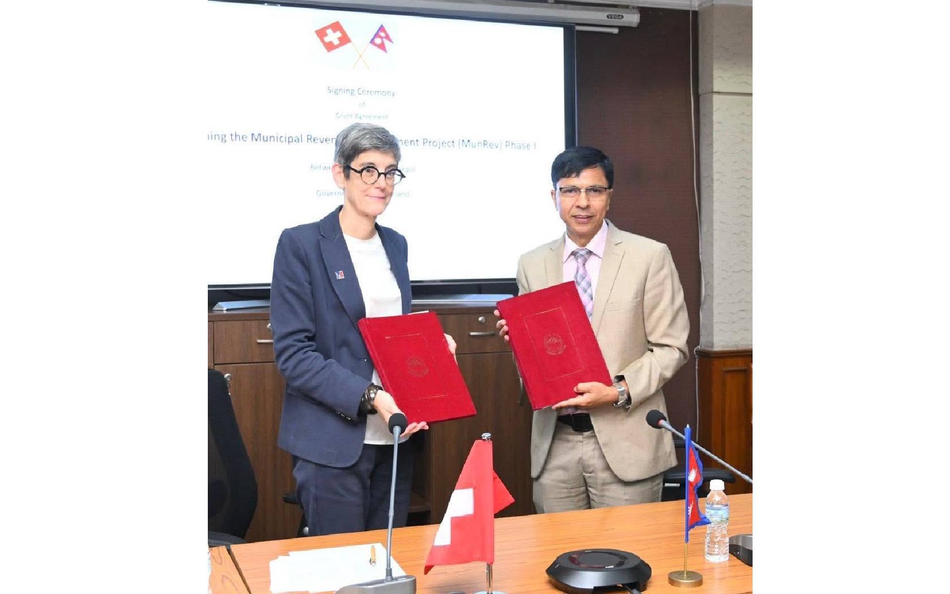 Swiss Ambassador Meuwly and Finance Joint Secretary Sharma Signs an agreement
